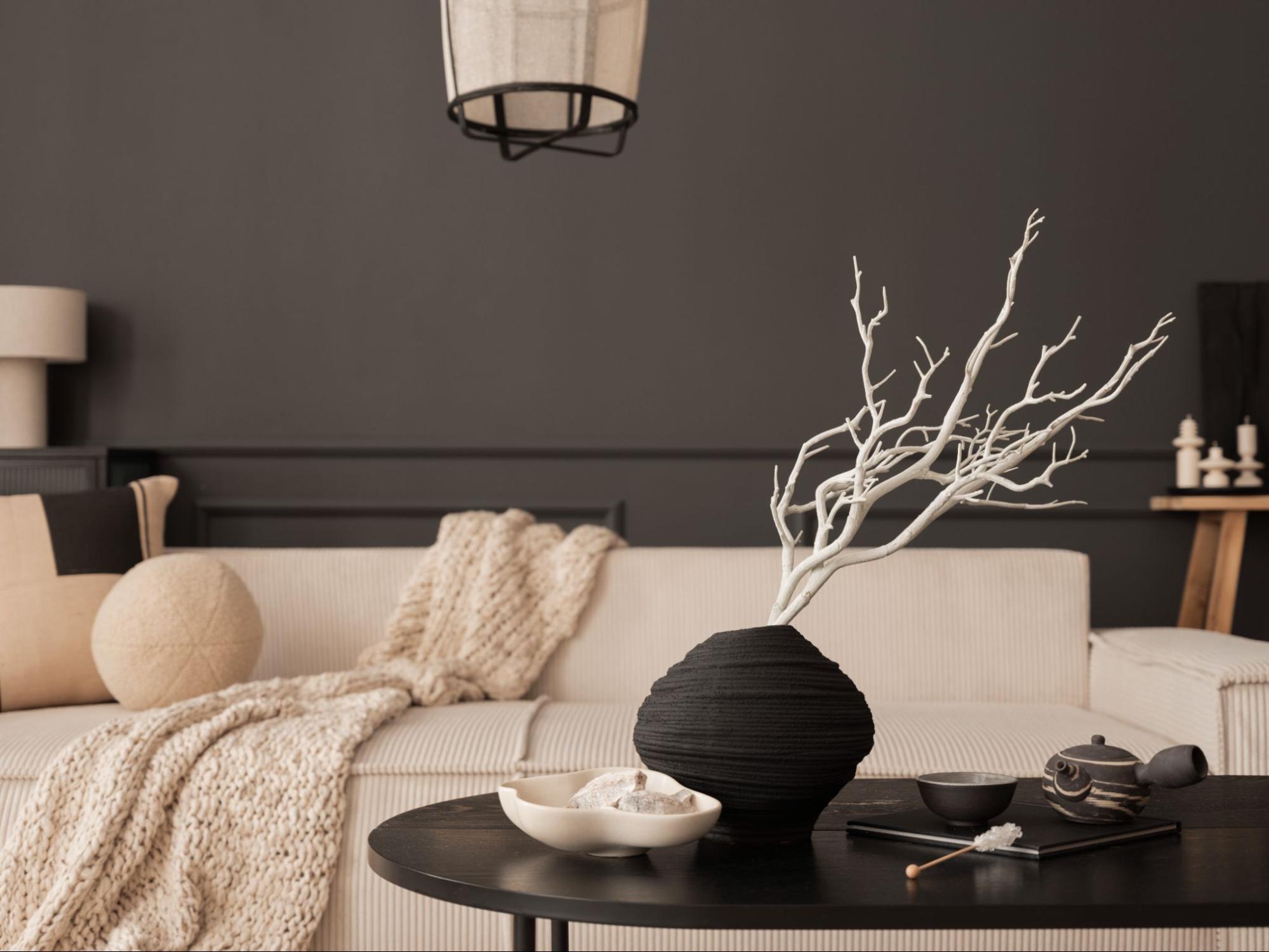 Modern living room with a table and couch. 
